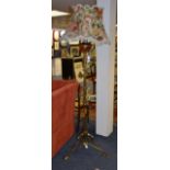 An Arts & Crafts brass and copper oil floor lamp with shade, in the manner of Benson,
