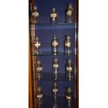 Twelve Victorian glass chemist jars with stoppers, all bearing name labels,