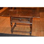 A Jacobean style oak side table, with rectangular plank top above single drawer and undertier,