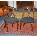 A set of ten Victorian mahogany dining chairs, with later upholstered stuffover seats,