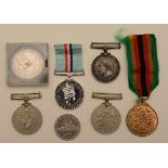 Five war medals, to include Zimbabwe Independence, The Rhodesia Medal,