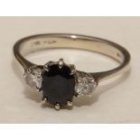 An 18ct gold sapphire and diamond three stone ring,