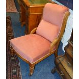 A Victorian mahogany lady's parlour armchair, upholstered in later pink velour,