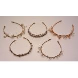 Four modern pearl tiaras, the wire head bands decorated with freshwater pearls,