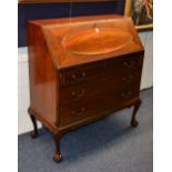 A mahogany writing bureau, with fall front writing flap, enclosing fitted drawers and pigeon holes,