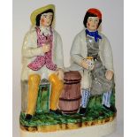 A 19th century Staffordshire flatback figure, depicting two gentleman drinking beer,