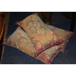 Three matching floral upholstered cushions,