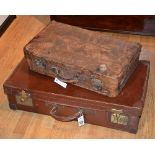 A vintage leather suitcase, 71cm wide, with a smaller hide example,