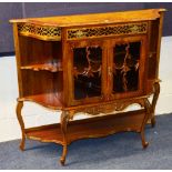 A walnut drawing room cabinet, with drawer above two glazed doors,