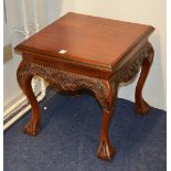 A modern mahogany lamp table, of square form, raised on cabriole and ball and claw supports,