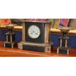A black slate and marble clock garniture,