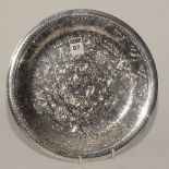 An Islamic white metal circular dish of Egyptian origin, possibly silver,