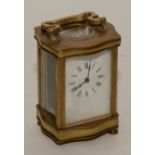 A brass carriage clock, with single train movement, with key, one foot lacking,
