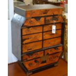 An Oriental inlaid table cabinet, with fitted drawers, lacquered panels to the sides and top,