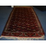 A Persian Yamout Bokhara carpet, with allover geometric diamonds in red,