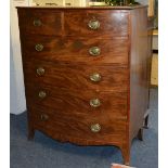 A George III mahogany bow front chest of drawers, with two short drawers above four long drawers,