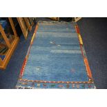 WITHDRAWN - An Eastern rug, with panels of camels on pale blue ground, with orange,