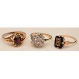 A 9ct gold and garnet ring, ring size T, 2.