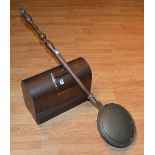 An antique Singer sewing machine, in wooden carry case,