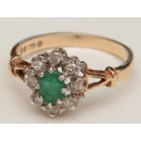 A 9ct gold emerald and diamond flowerhead ring,