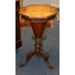 A Victorian sewing/games table, the octagonal hinged top with inlaid chess board decoration,