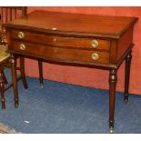 A Regency style mahogany side table, circa 1920's, the serpentine front with two drawers,