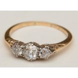 An Edwardian three stone diamond ring,