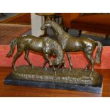 A cast bronze figure group of two horses, raised on marble type rectangular plinth,