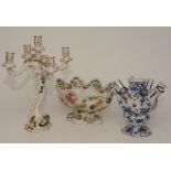 A Dresden porcelain four branch candelabra, decorated with encrusted floral panels,