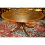 A large reproduction George III style circular dining table,