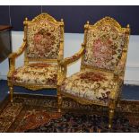 A pair of reproduction Regency style gilt parlour armchairs, upholstered in floral velour,