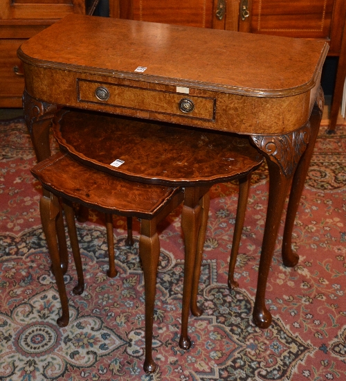 A walnut side table, with single drawer, raised on cabriole supports and pad foot,