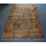 An antique Afghan Bluch rug, the central blue and red diamond over blue ground,