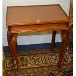 A modern mahogany nest of two tables, raised on cabriole and ball and claw supports,