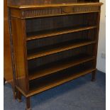 A mahogany open bookcase by Waring & Gillow, enclosing three shelves, label to back,