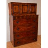 A Victorian composite cupboard chest, with three panelled doors, above four graduated drawers,