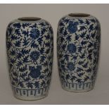 A pair of Chinese oviform blue and white vases, decorated with allover foliage pattern,