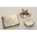 A silver cigarette case with hallmarks for Chester, monogrammed,
