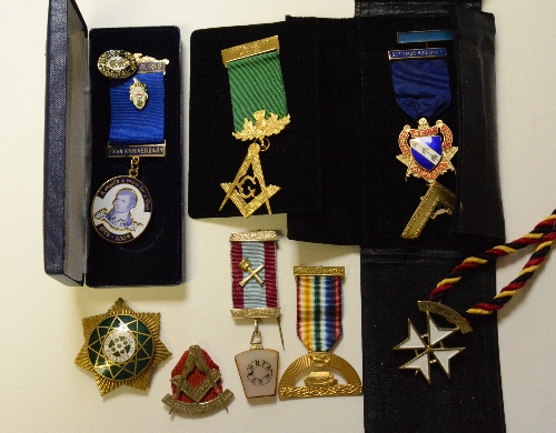 A collection of various Masonic badges and medals,