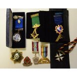 A collection of various Masonic badges and medals,