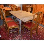 A vintage oak pull out dining table with five matching oak Queen Anne style dining chairs,