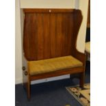 An oak hall settle, with high back,