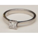 A platinum solitaire diamond ring, the princess cut diamond measuring approx. 0.