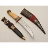 An Indo Persian Kharjar dagger, with polished bone handle and leather sheath, 30cm long,