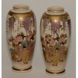 A pair of Japanese Satsuma ovoid vases, in typical colours with panels of Geishas in foliage,