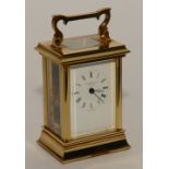 A brass carriage clock signed by James Ritchie & Son Edinburgh, visible single train movement,