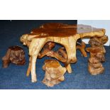 An articulated burr 'tree root' table , with four matching stools, table 62cm high x 150cm wide,