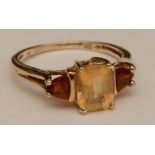 A 9ct gold citrine and tourmaline three stone ring,