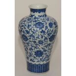 A Chinese blue and white baluster shaped vase, with allover floral decoration,