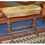 A Victorian figured walnut fold over card table, the swivel top enclosing felt lined interior,